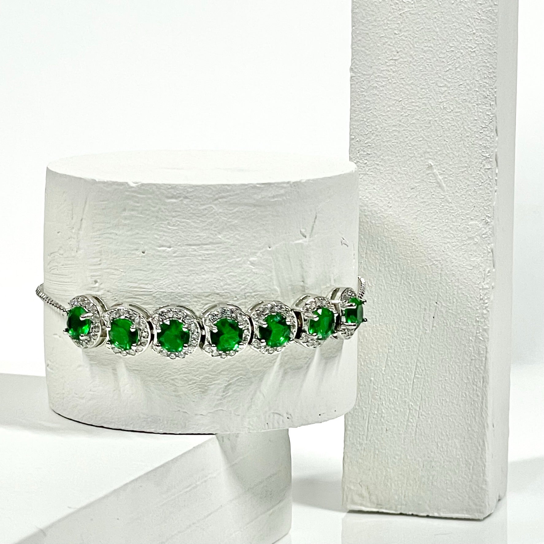 Halo bracelet with green cz stones